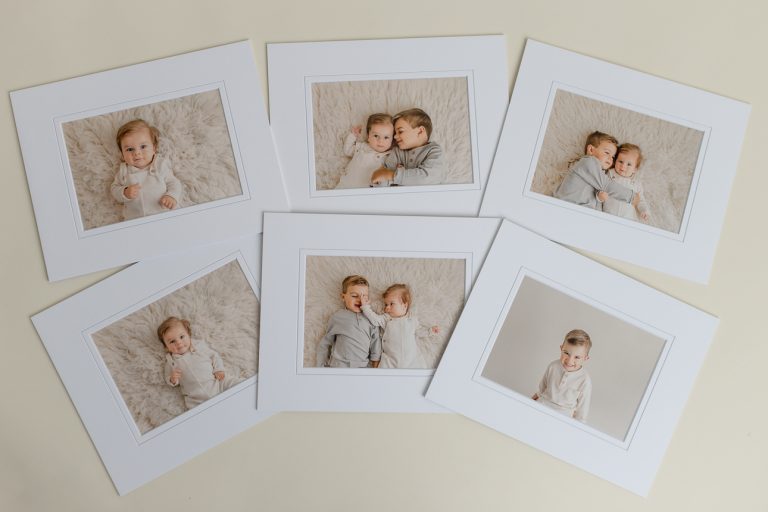 Six professionally matted portraits showing a toddler and baby brothers snuggling and playing during a studio photo session.